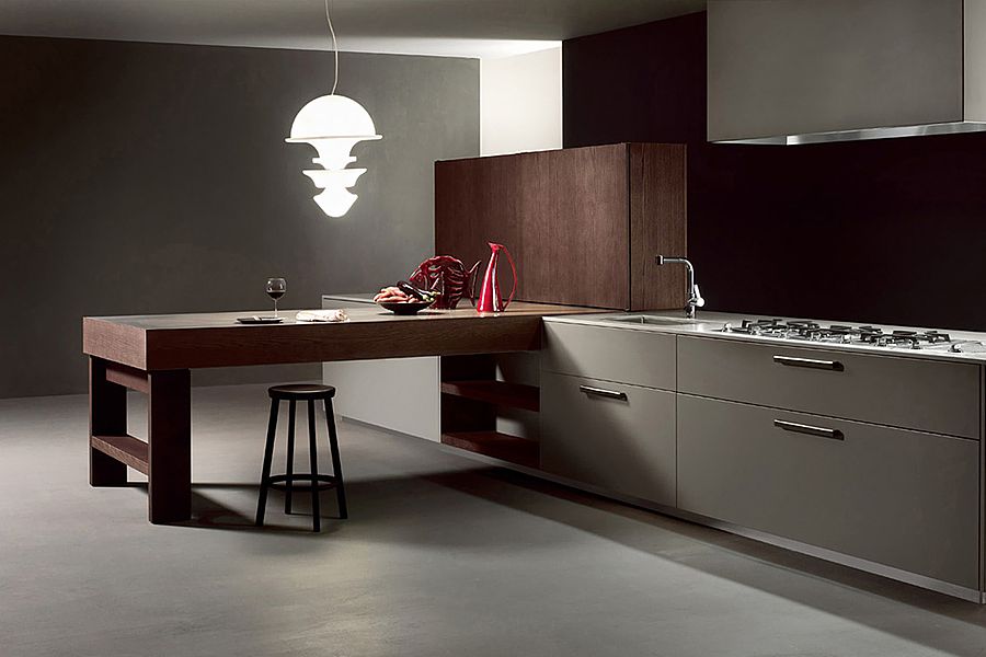 Linee minimaliste, pulite, giochi geometrici e un grande volume centrale, contraddistinguono questo progetto. Modello T06 in finitura bianco laccato opaco. L’ampia zona lavoro del bancone centrale rende la composizione funzionale e libera. Il blocco è realizzato in eco cemento e divide la zona pranzo dal salotto interpretando lo spazio.